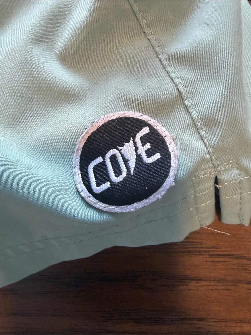 Cove Men’s Sage Green Swim Trunks with Pink Drawcord